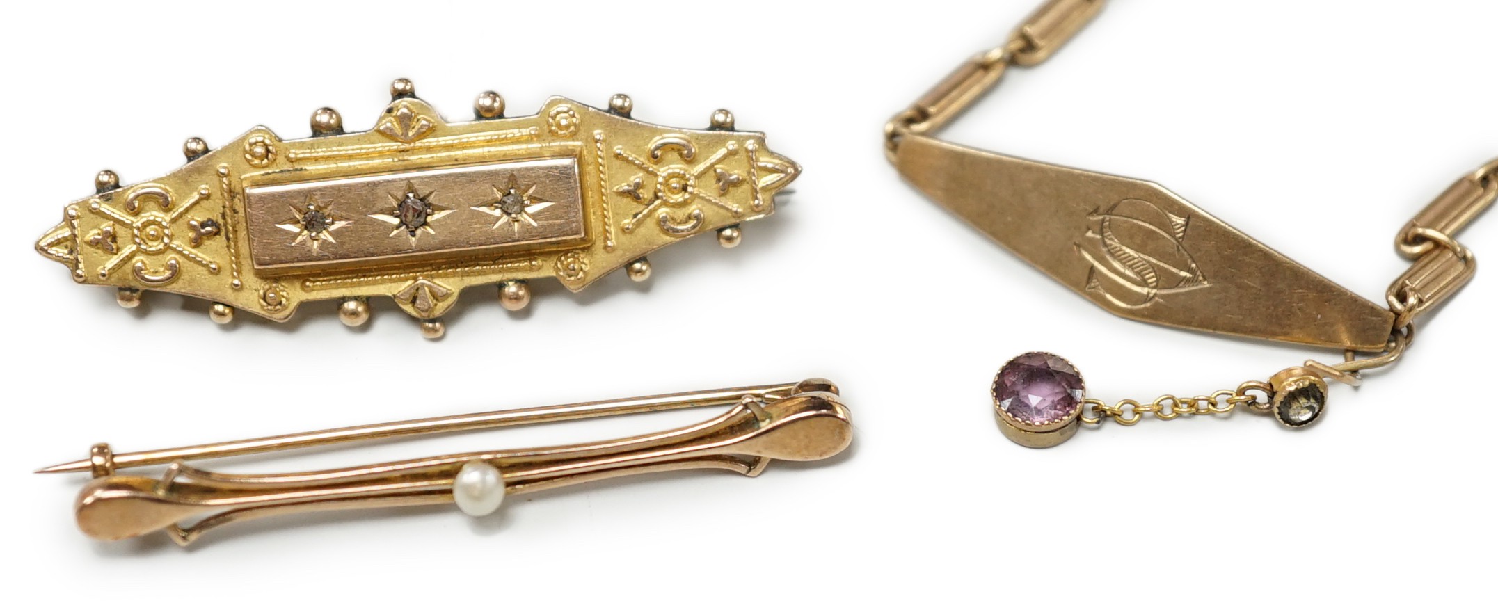 Two early 20th century yellow metal brooches including 9ct and diamond chip set and a seed pearl set bar brooch by Murrle Bennett & Co?, together with a 9ct identity bracelet, gross weight 10.6 grams.